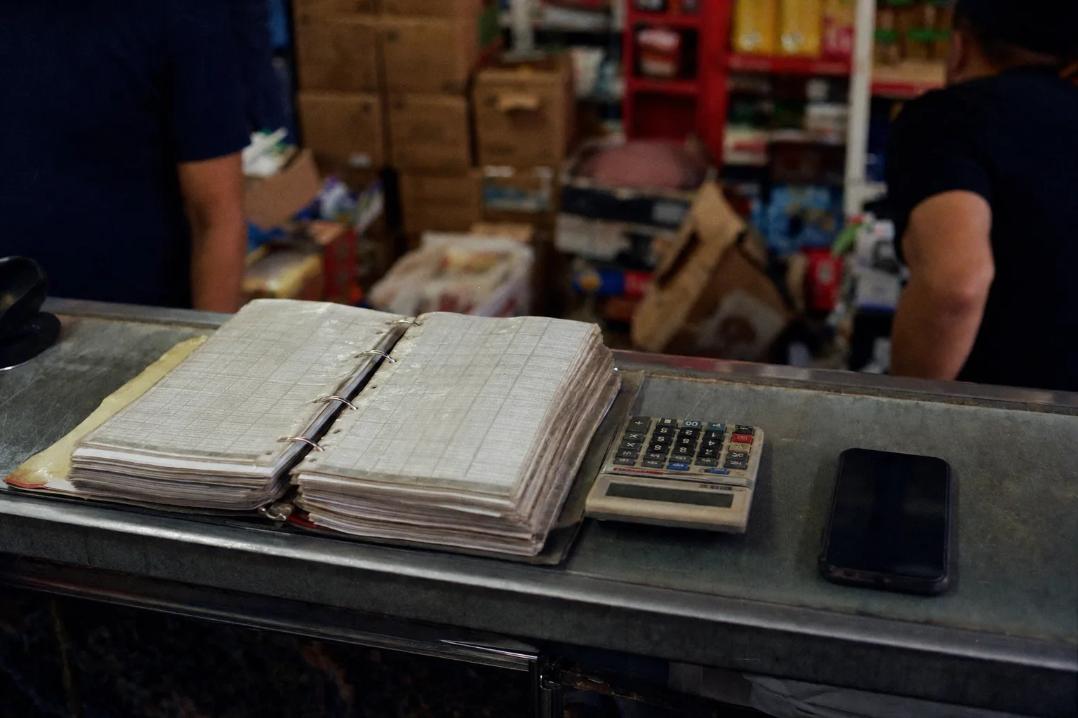 Distributor counter with price-list binder, calculator and phone